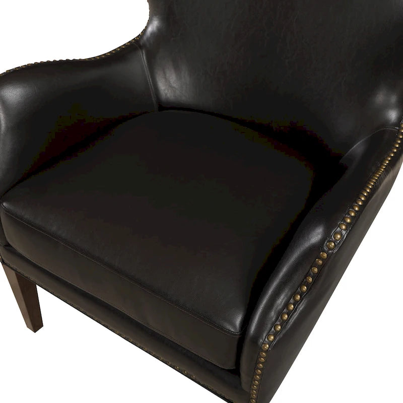 Fauteuil d'appoint à accoudoirs inclinés et hauts pieds en similicuir avec clous décoratifs
