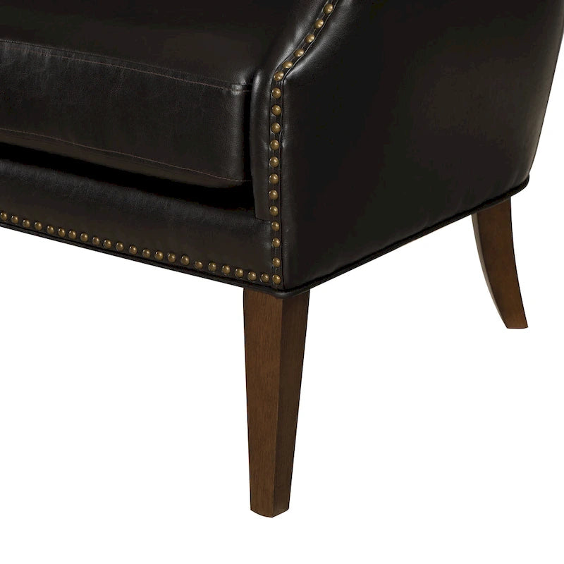 Fauteuil d'appoint à accoudoirs inclinés et hauts pieds en similicuir avec clous décoratifs
