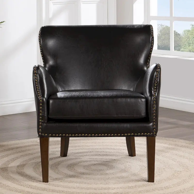 Fauteuil d'appoint à accoudoirs inclinés et hauts pieds en similicuir avec clous décoratifs