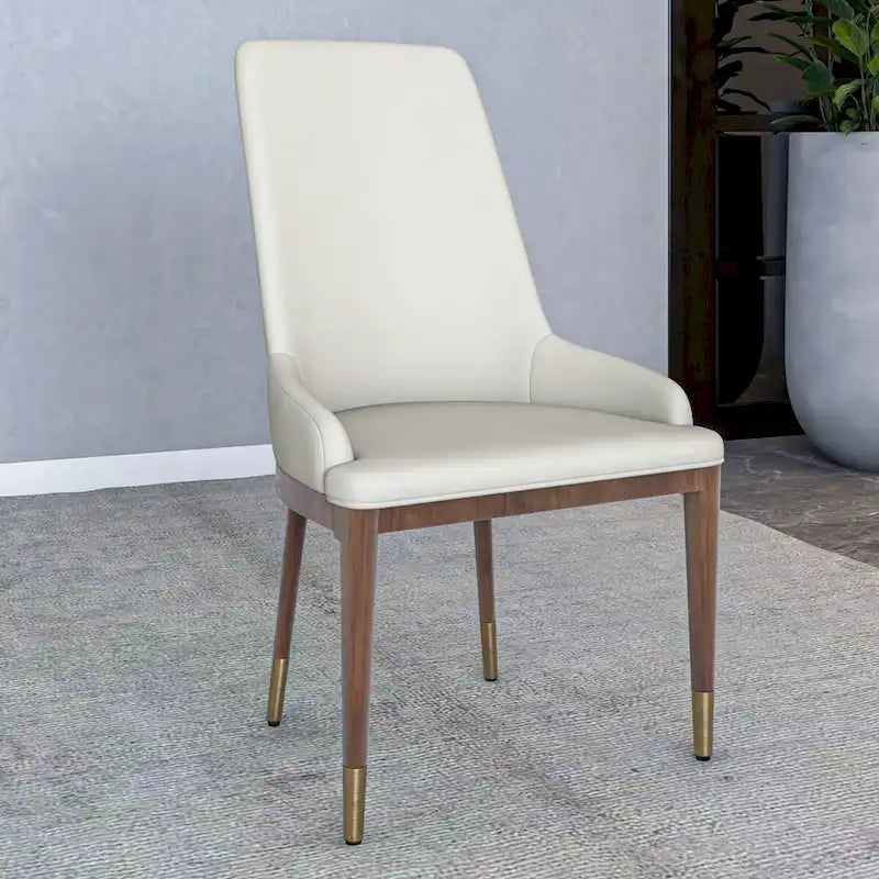 Chaise de salle à manger moderne rembourrée en cuir avec dossier haut en mousse
